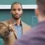 An instructor calls on students who are raising their hands to respond.
